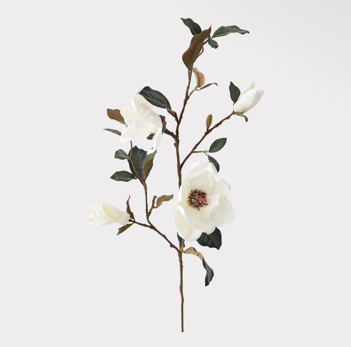 Faux magnolia flowering branch with white blooms