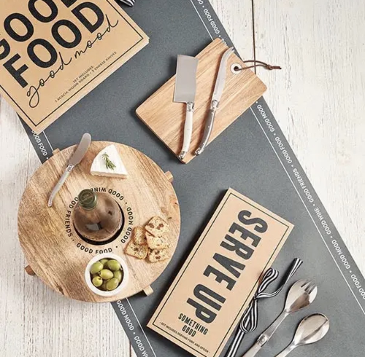 Wooden serving boards, cheese knives and hosting pieces styled for gathering