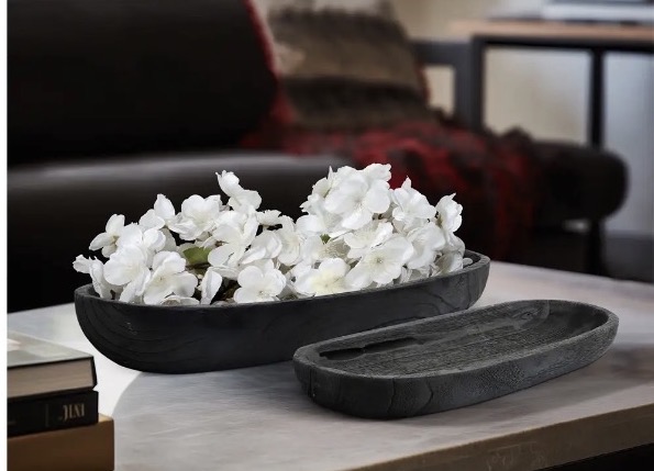 Two dark dough bowls, one styled with white flowers